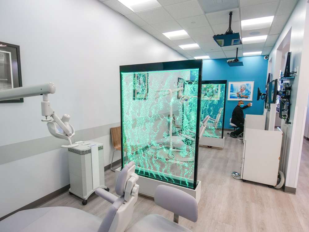 Treatment chair with overhead light and provider