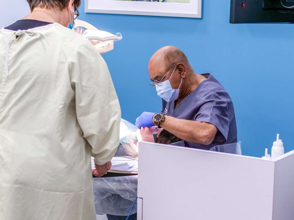 Dentist treating a young patient